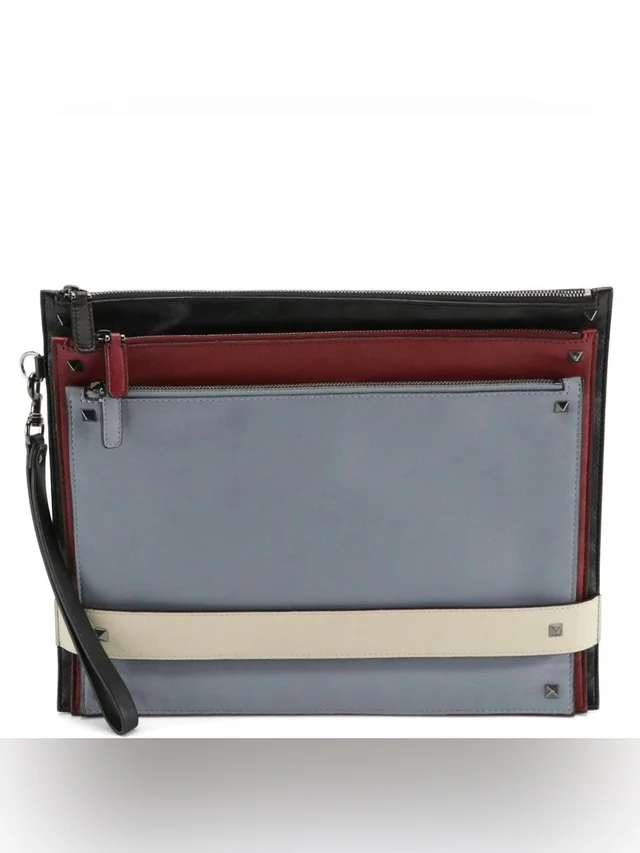 Valentino Garavani Rockstud Triple Zip Clutch in black|red Calfskin from Poshmark