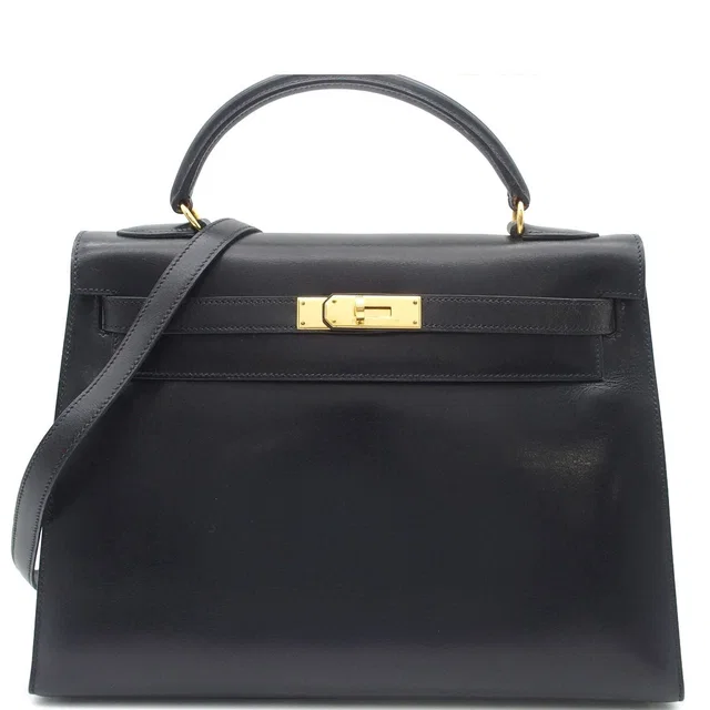 Hermès Kelly 32 Black Gold Box Calf Sellier 2-Way Shoulder Bag in Black Box leather from The Reluxe