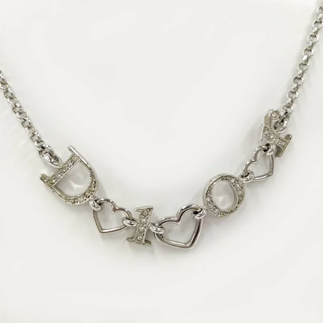 Dior Heart Charm Necklace Plated Silver in Silver from The Reluxe