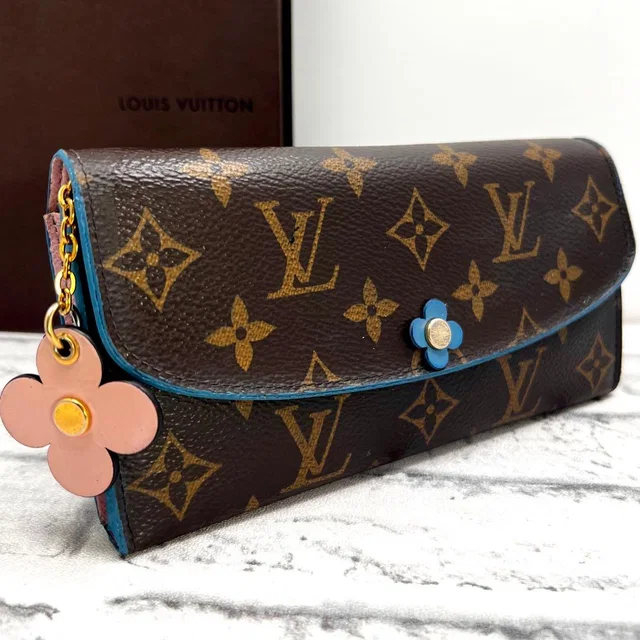 Louis Vuitton Monogram Portefeuille Emily Flower Charm Blue Wallet in Blue from The Reluxe