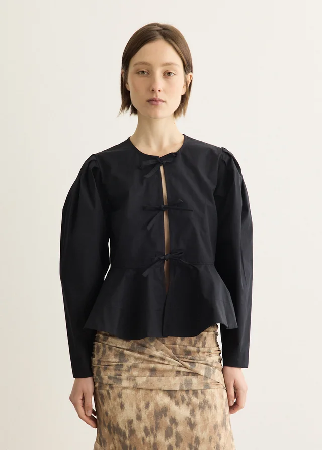 Ganni Compact Poplin Long Sleeve Peplum Blouse in Black from Incu, photo 1 of 1