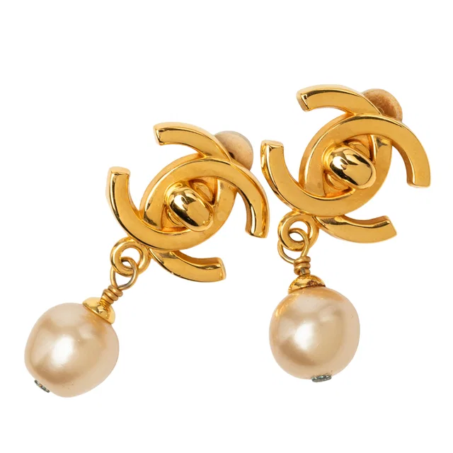White Chanel CC Gold Plated Faux Pearl Drop Turn Lock Clip On Earrings in White from Designer Revival