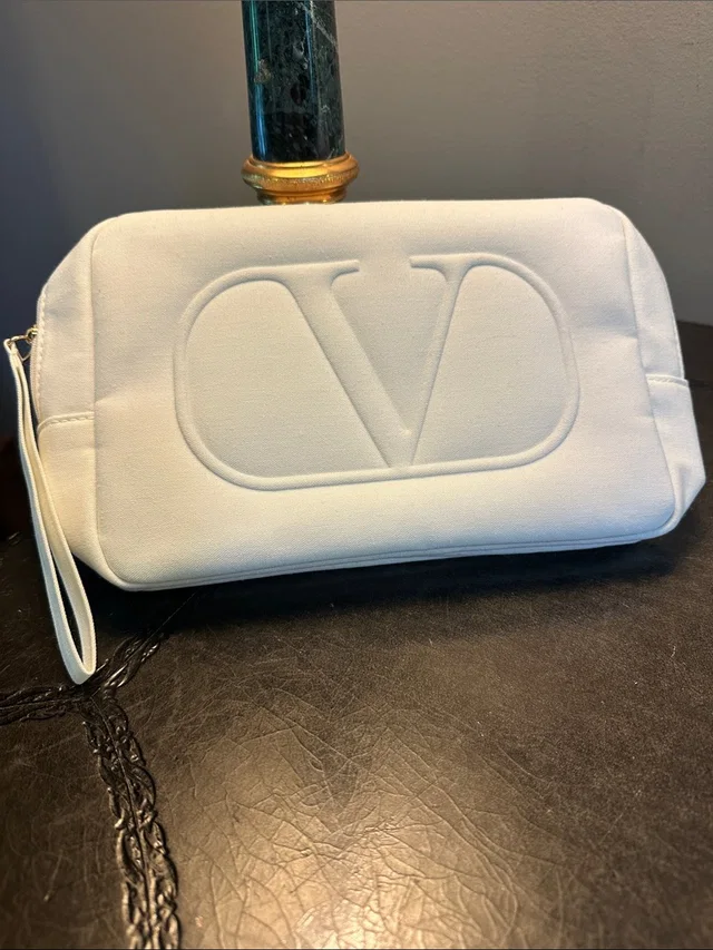 Valentino Garavani Embossed V Wristlet Clutch/ Makeup Bag in white from Poshmark