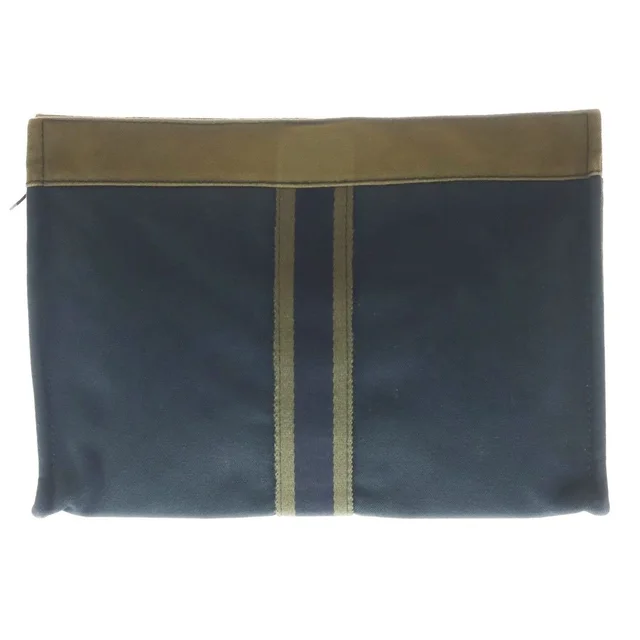 Hermès Fourre Tout Canvas Clutch Silver Khaki Navy in Navy Canvas from The Reluxe