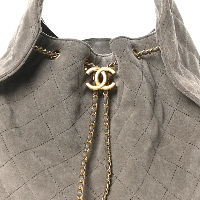 Quilted Medium Chanel 25 Handbag Dark Grey in Grey Suede from FASHIONPHILE, photo 7 of 9
