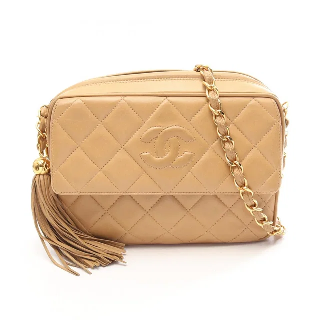 Chanel Shoulder Bag CC Logo Quilted Beige Lambskin Fringe Chain in Beige Lambskin from The Reluxe