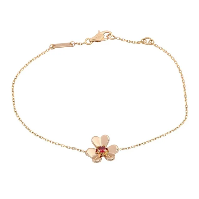 Van Cleef & Arpels 18k Gold Ruby Charm Bracelet in gold from Poshmark