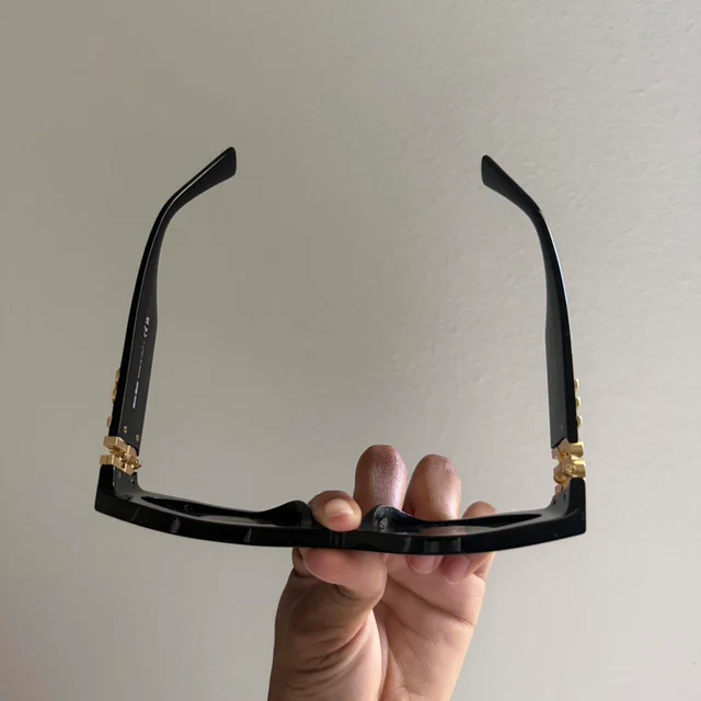 Miu Miu Women's Sunglasses - Black in black from Depop, photo 3 of 8