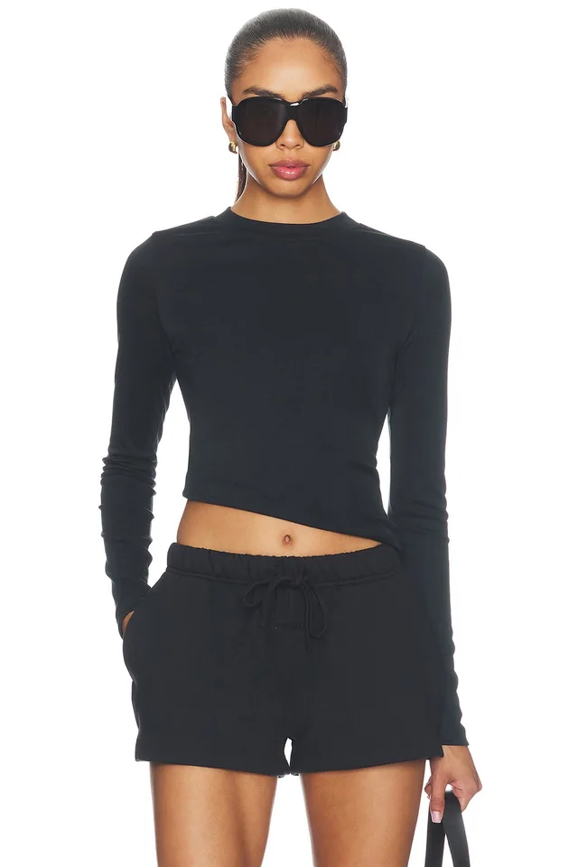 Fear of God ESSENTIALS Fitted Longsleeve Tee in Black from REVOLVE (Canada), photo 1 of 1