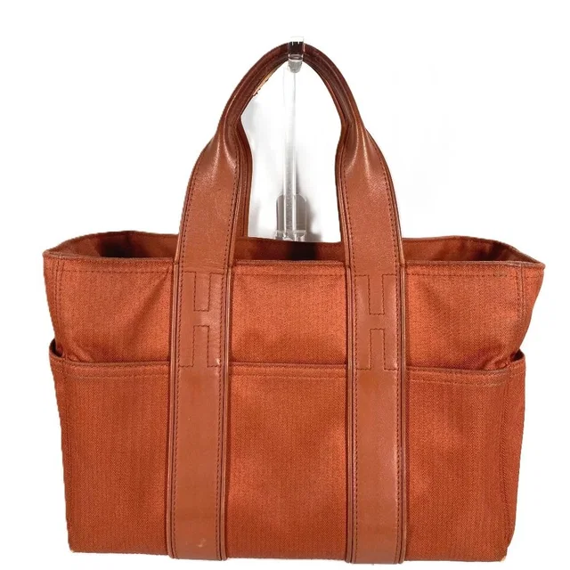 Hermès Handbag Acapulco PM Cotton Orange in Orange Nylon from The Reluxe