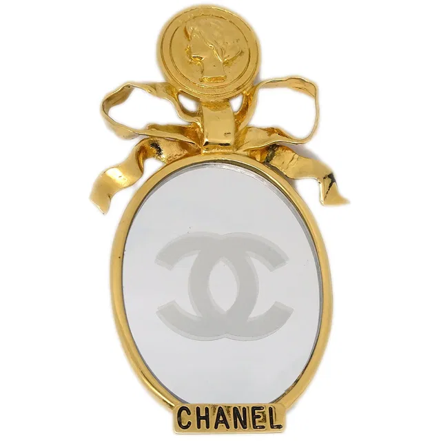 Chanel Bow Mirror Brooch Pin Gold in Gold from AMORE Vintage Tokyo