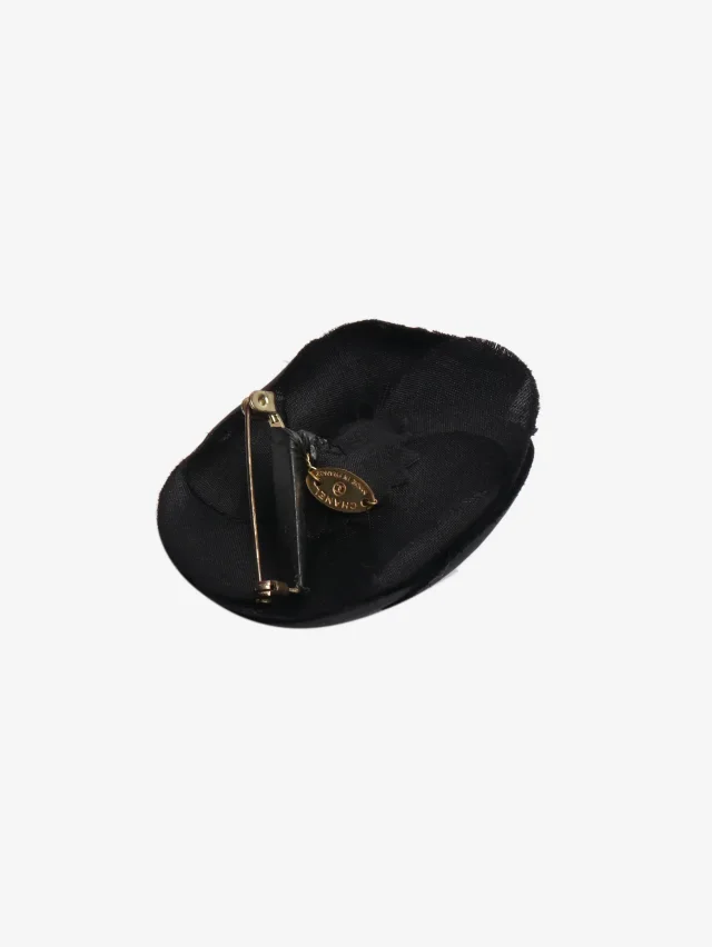 Chanel Black Camellia small floral brooch in Black from Sign of the Times, photo 2 of 3