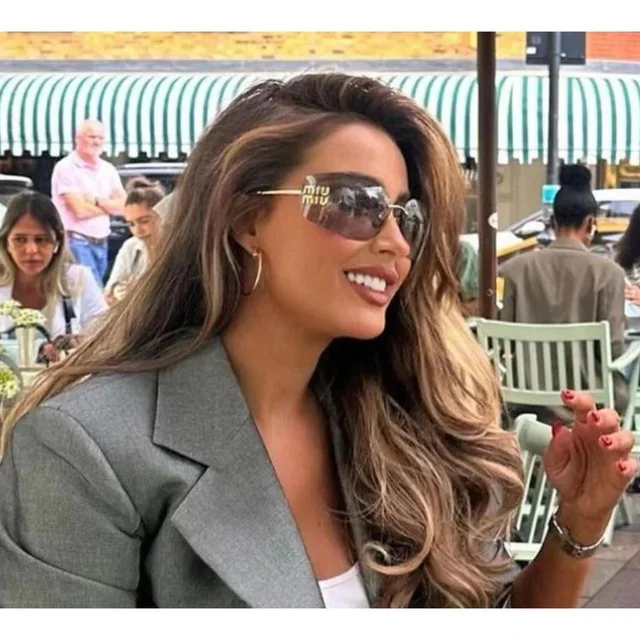 Miu Miu Women's Sunglasses - Grey/Gold in gray|gold from Depop, photo 1 of 1