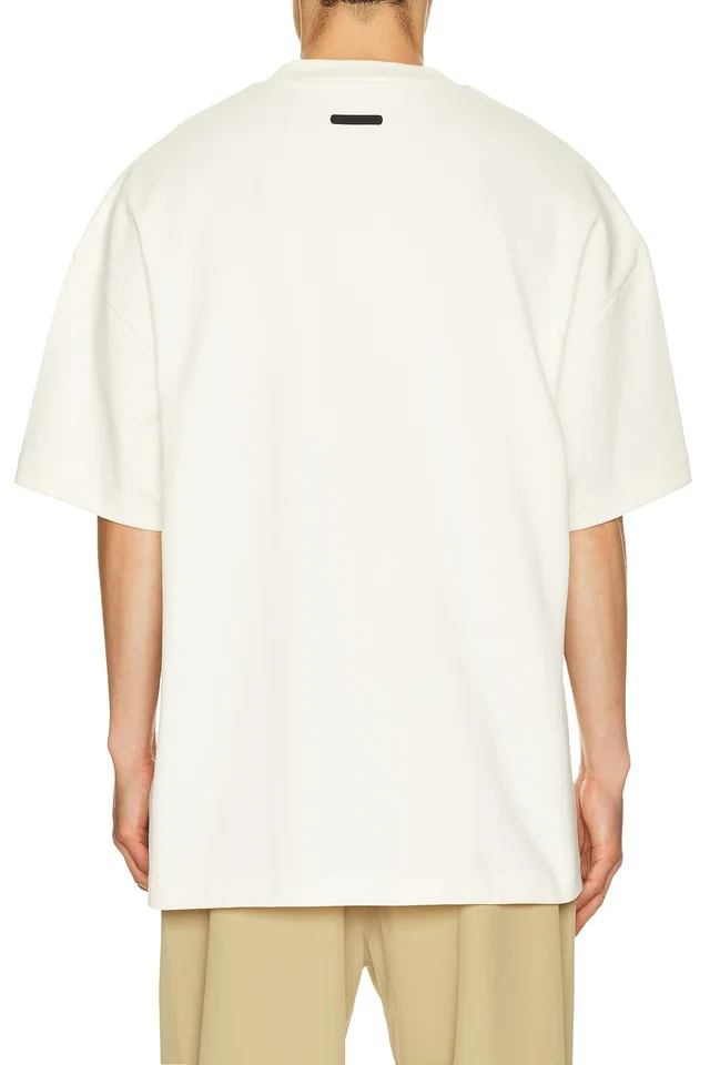 Fear of God ESSENTIALS Signature 90's Short Sleeve Tee in Ivory, photo 2 of 5 from REVOLVE (Canada)