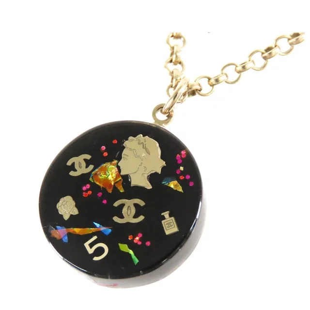 Chanel 06A CC Logo Icon Pendant Gold Black Metal Plastic Camellia Necklace in Black from The Reluxe