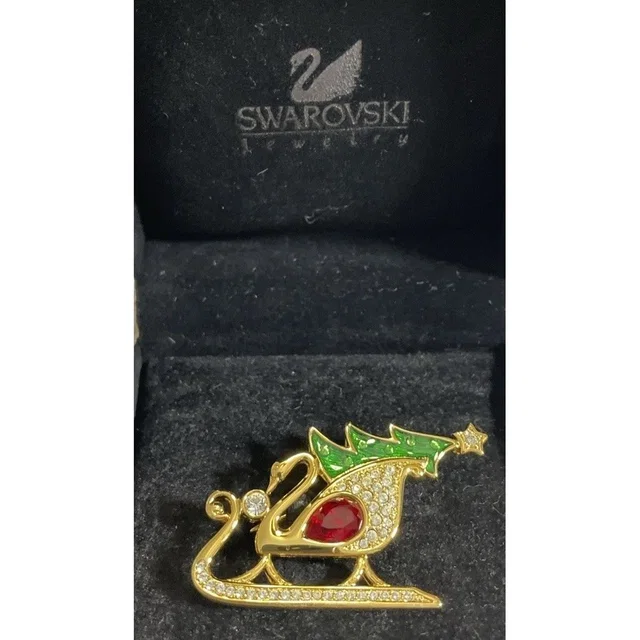 Swarovski Swan Signed Gold Tone Green Enamel Clear Red Crystals Sleigh Brooch in yellow|green|gold|red from Poshmark