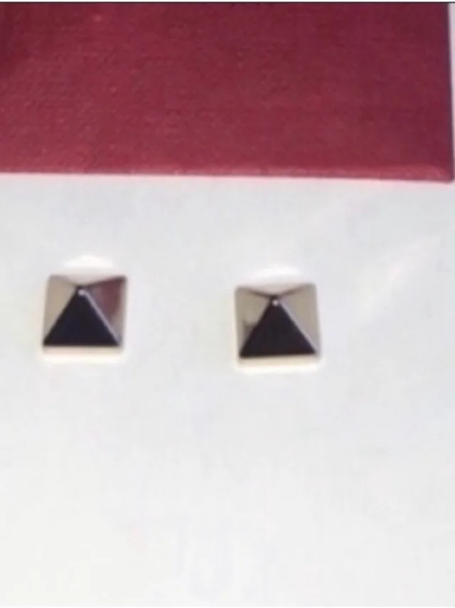 Valentino Garavani Black And Gold Pyramid Stud Earrings in silver|black|gray from Poshmark