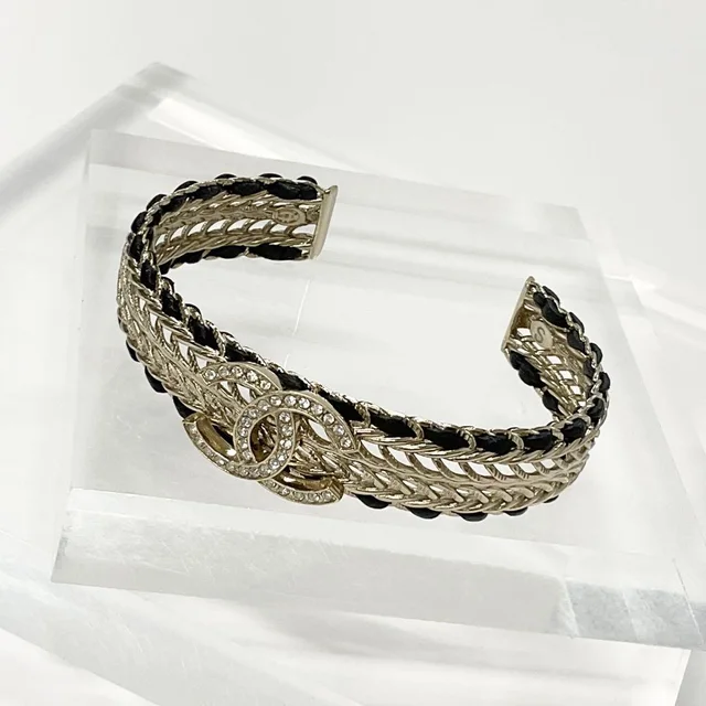 Chanel CC Logo Bangle Rhinestone Leather Bracelet Gold in Gold Leather from The Reluxe