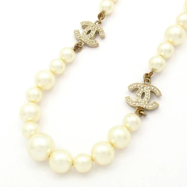 Chanel Necklace CC Logo Ivory Gold Faux Pearl Rhinestone in White from The Reluxe