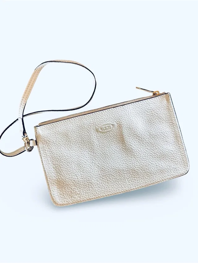 Tod's Metallic Gold Pebbled Leather Wristlet in white Leather from Poshmark, photo 1 of 1