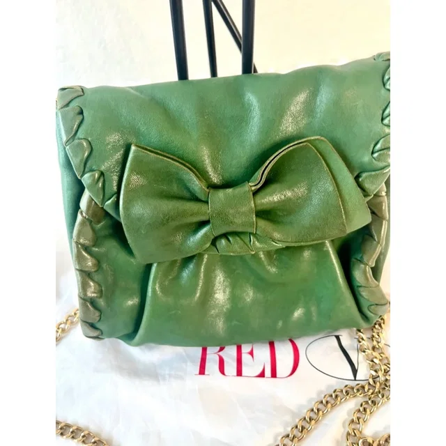 REDValentino Olive Green Leather Clutch Crossbody Bow Bag With Gold Metal Strap in green Leather from Poshmark