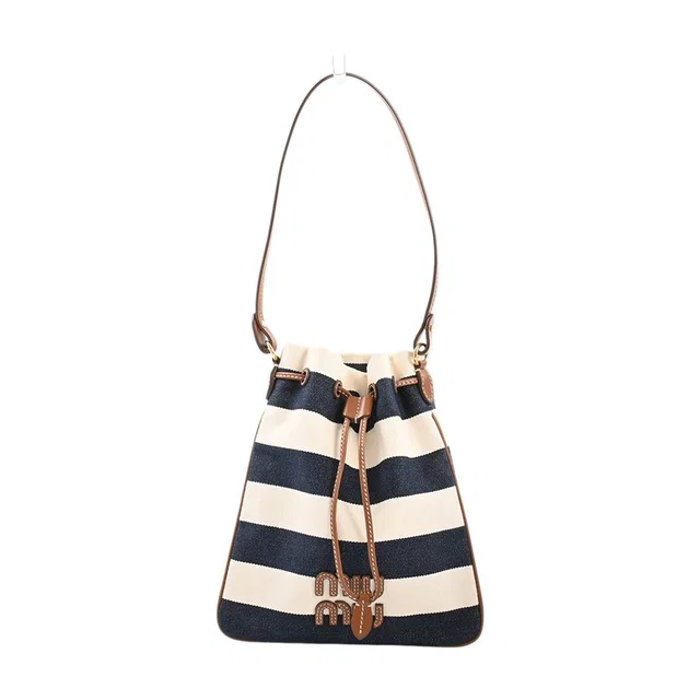 Miu Miu Drawstring Mini Bag in Canvas from The Reluxe