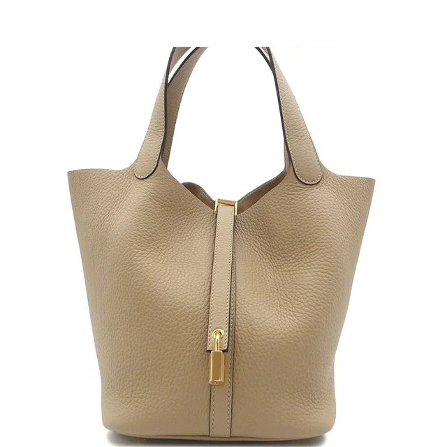 Hermès Picotin Lock MM Trench Gold Taurillon Clemence Handbag in Gold Clemence leather from The Reluxe