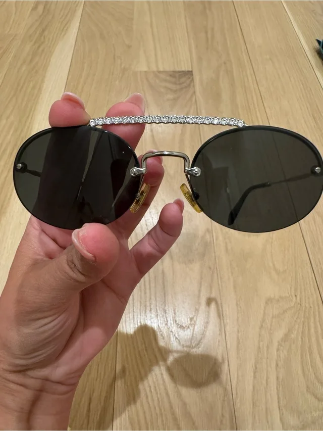 Miu Miu Oval Black Lens Societe Rimless Sunglasses With Crystal Brow Bar in silver|black|gray from Poshmark