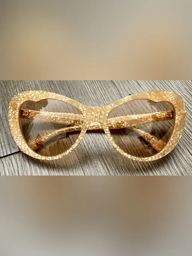 Miu Miu Speckled Glittery Cat-Eye Sunglasses in gold from Poshmark
