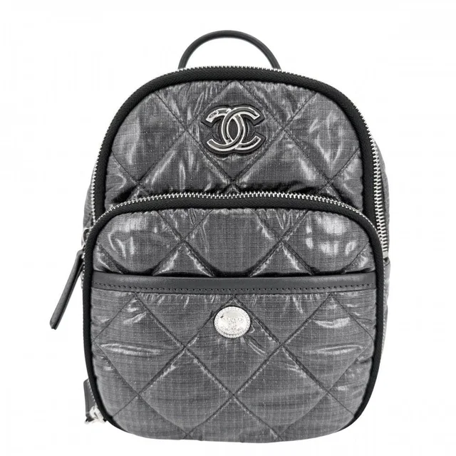 Chanel Quilted Coco Neige Chain Shoulder Lame Backpack CC Logo Nylon Gray Silver in Grey Nylon from The Reluxe