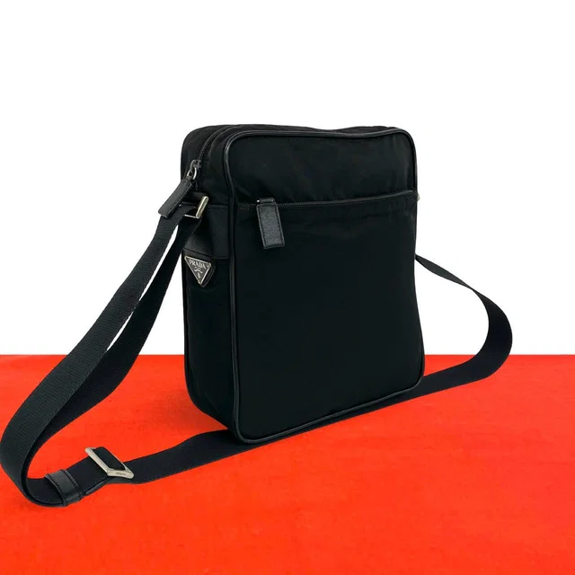 Prada Triangle Logo Tessuto Pocono Nylon Saffiano Leather Shoulder Bag Pochette in Saffiano leather from The Reluxe