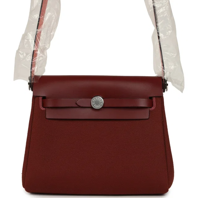 Hermès Herbag Zip 20 Mini Rouge H Toile Militaire Canvas and Vache Hunter Palladium Hardware in Burgundy Canvas from Madison Avenue Couture