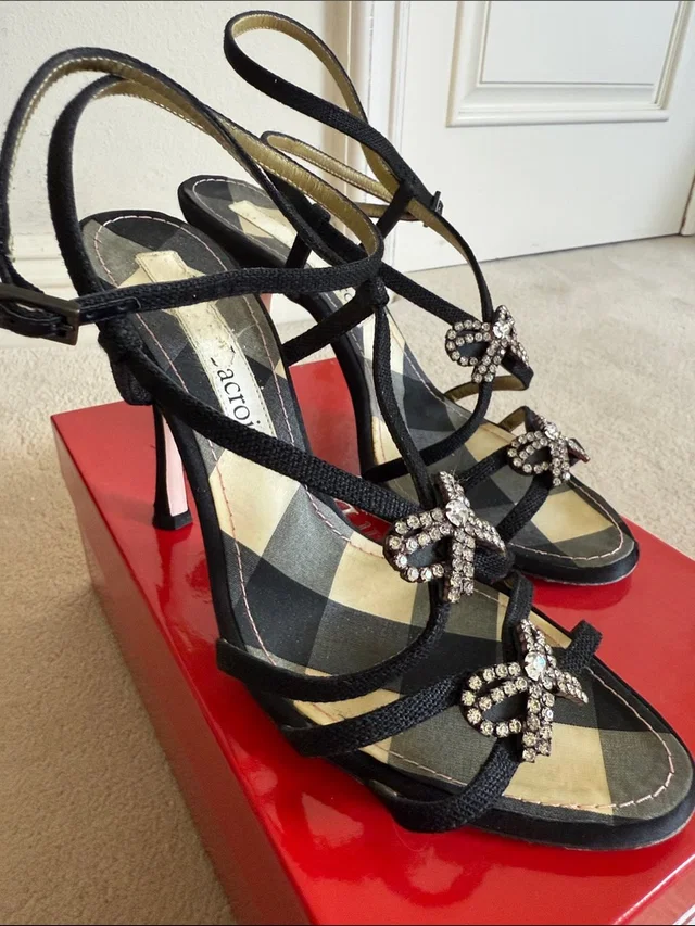 Christian Lacroix Black Strappy 4 Inch Heels With Crystal Bow Accents in black|gray|silver from Poshmark