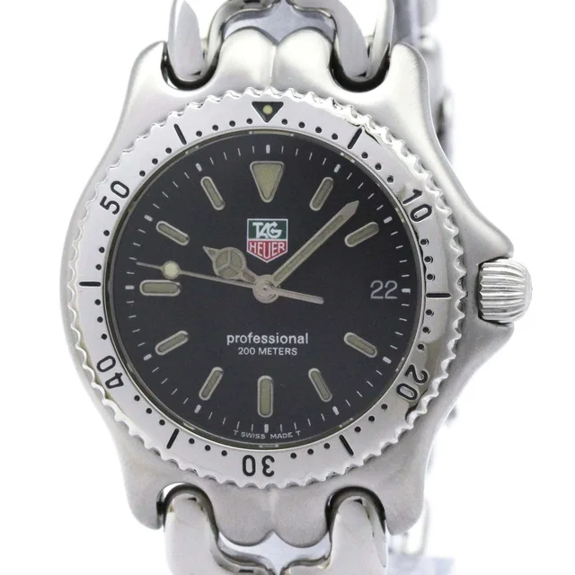 TAG Heuer Men’s Stainless Steel Black Dial Professional Watch in gold from Poshmark