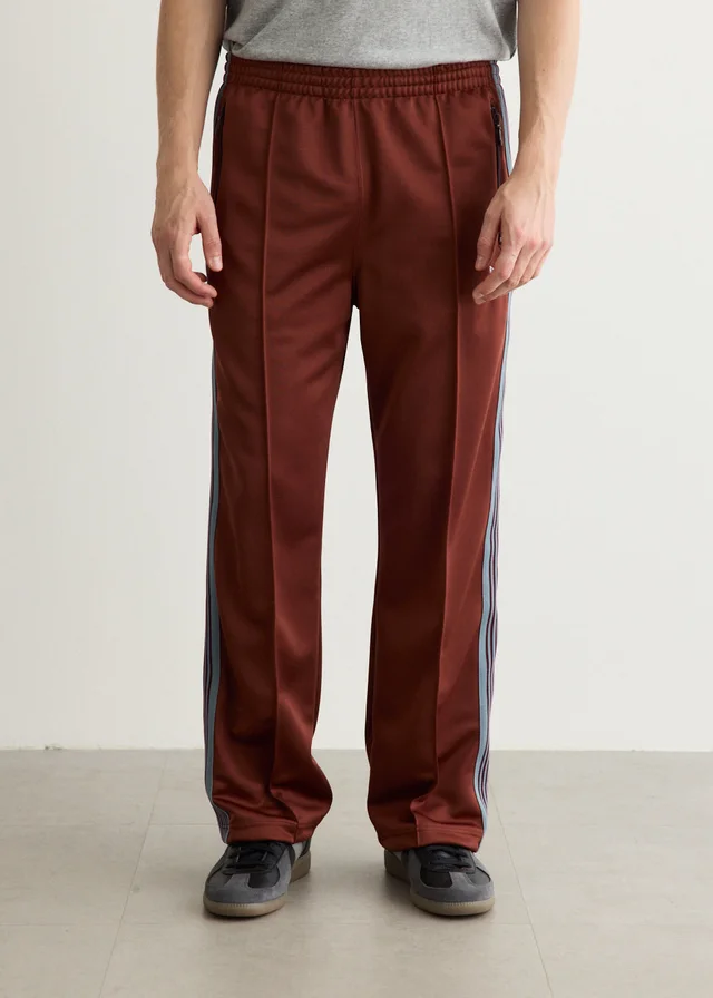 Needles Poly Smooth Track Pants in Orange from Incu, photo 1 of 1