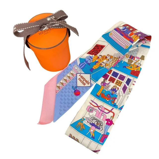Hermès la Maison Des Carres Des Carre Silk Twilly Scarf White in White Silk from The Reluxe