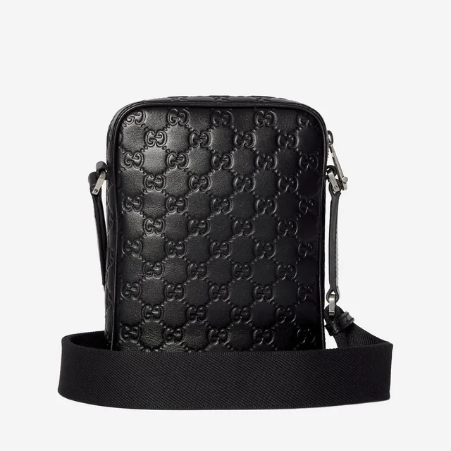 Gucci Gg Embossed Leather Crossbody Bag — Black in Black Leather from HEWI, photo 2 of 2
