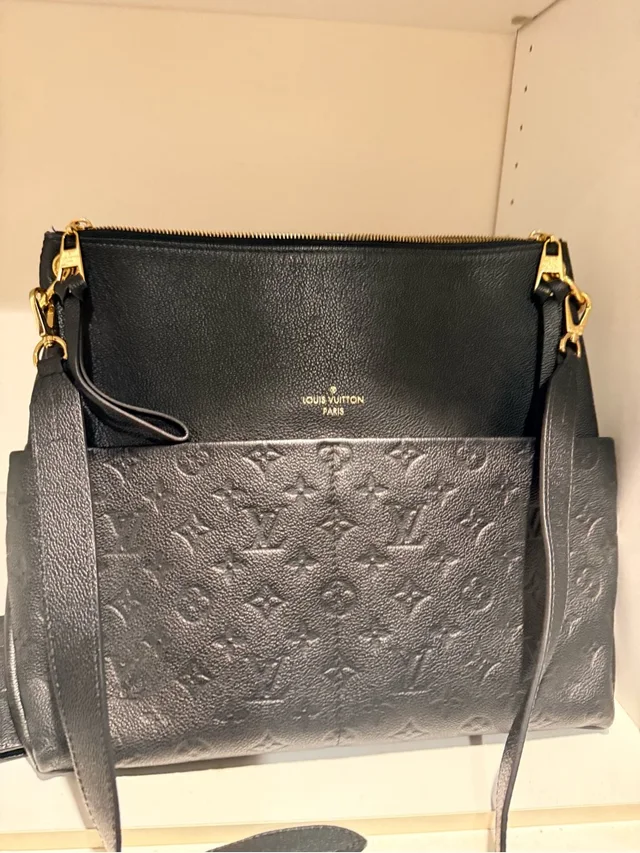 Louis Vuitton Embossed Monogram Shoulder Bag in black Leather from Poshmark, photo 1 of 1
