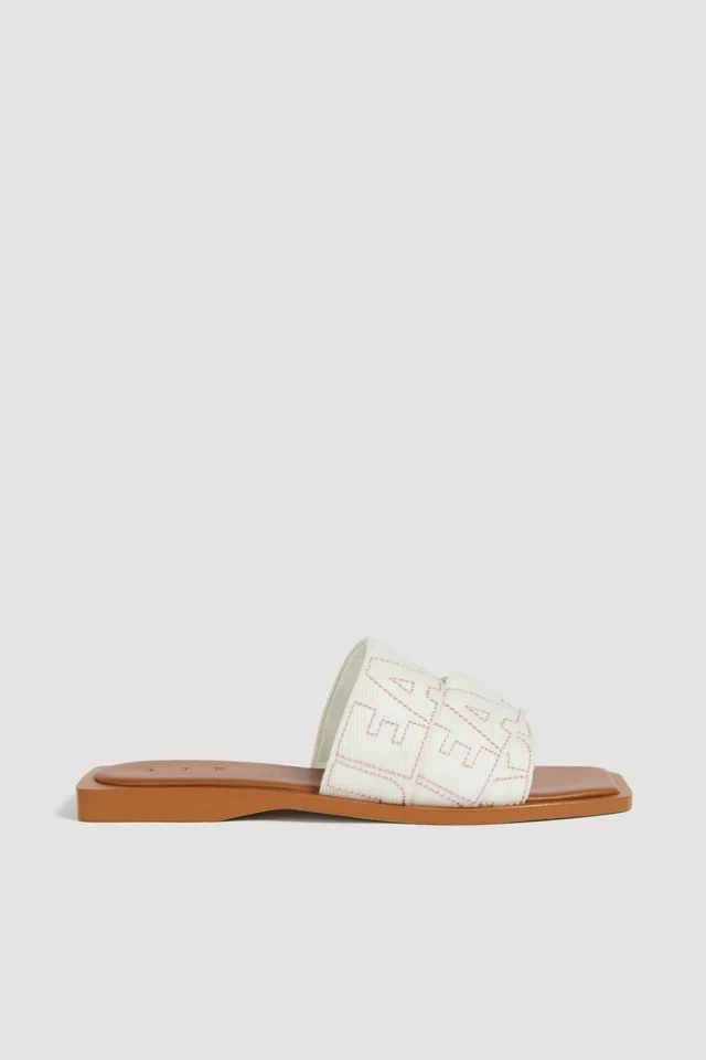 AJE Aliya Logo Slide in White from Aje, photo 1 of 1