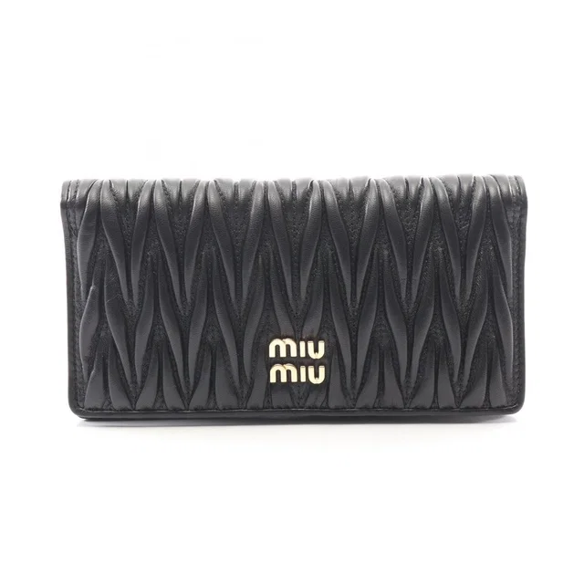 Miu Miu Matelasse Bi Fold Long Wallet Leather Black in black Leather from Poshmark