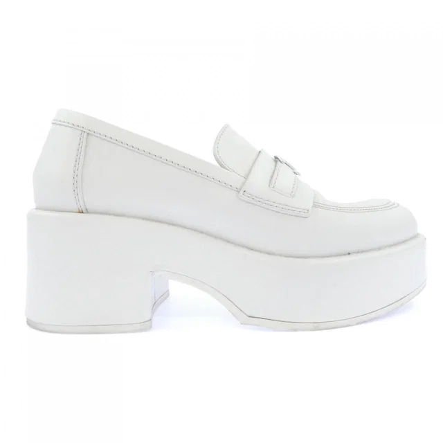 Chanel Loafers Shoes White in White Calfskin from The Reluxe