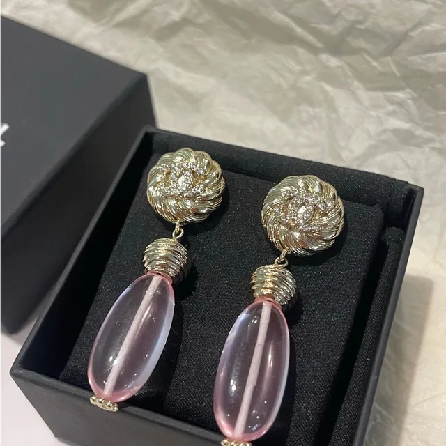 Chanel earrings in orange|pink from Poshmark, photo 1 of 1