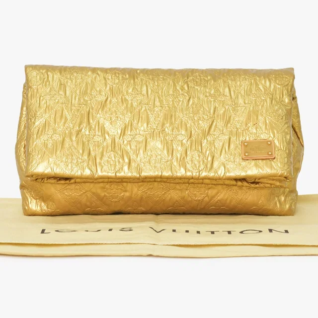 Louis Vuitton Clutch Limelight PM Gold Silk Wool in Gold Silk from The Reluxe