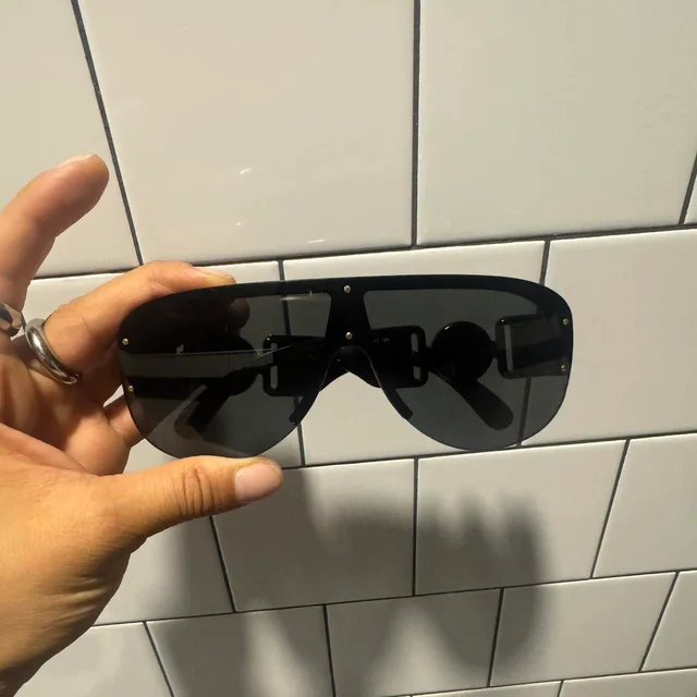 Versace Women's Oversized Sunglasses - Black/Gold in black|gold Nylon from Depop, photo 1 of 1