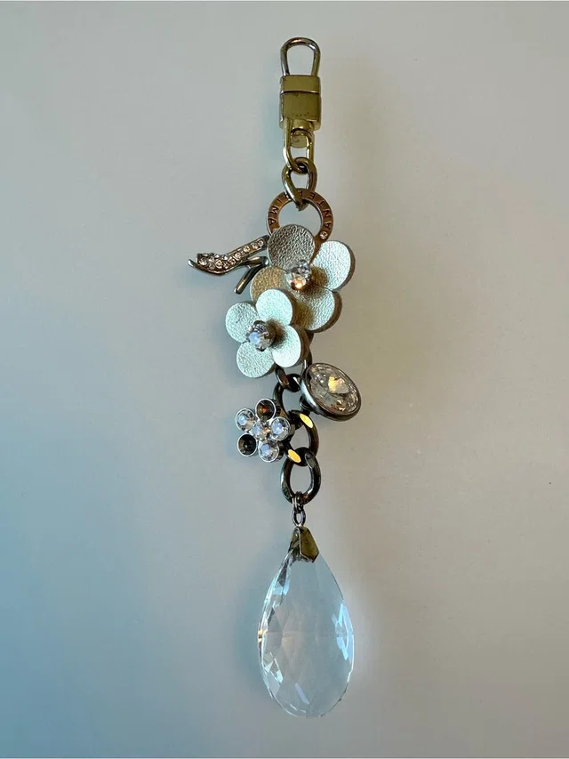 Anteprima Floral Crystal Teardrop Charm in gold Leather from Poshmark