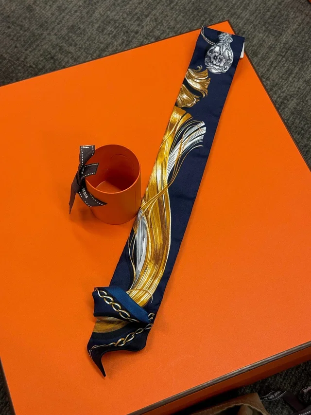 Hermès Twilly - Navy & Gold Feather Print in Navy Silk from Luxury Promise