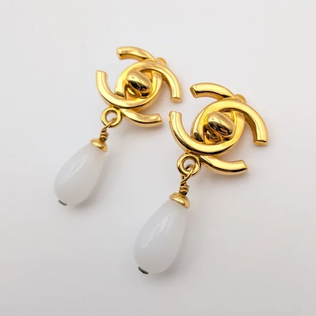 Chanel 95P Earrings CC Logo Turnlock Gold Faux Pearl Drop Swing Vintage in Gold from The Reluxe