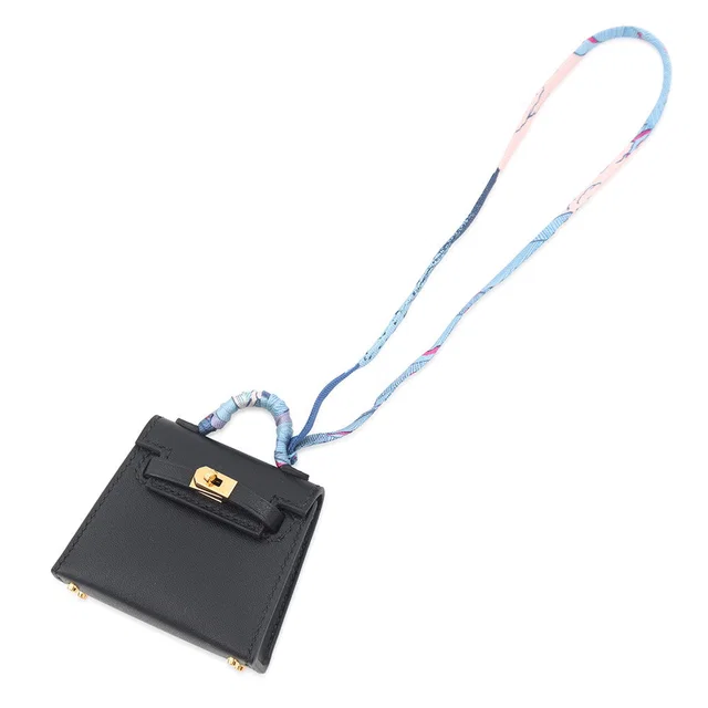 Hermès Kelly Twilly Bag Charm Black Tadelakt Leather Silk in Black Silk from GALLERY RARE