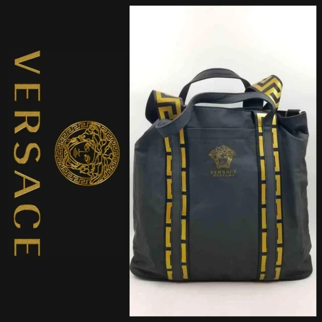 Versace Women's Luggage and travel - Navy/Gold in blue|gold from Depop, photo 1 of 1
