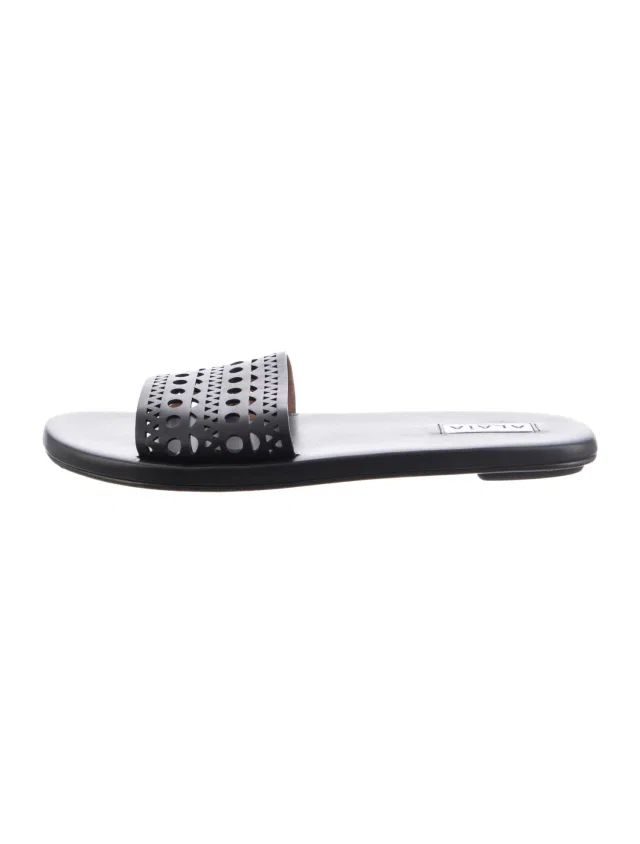 Alaïa Leather Lasercut Accents Slides in black Leather from The RealReal
